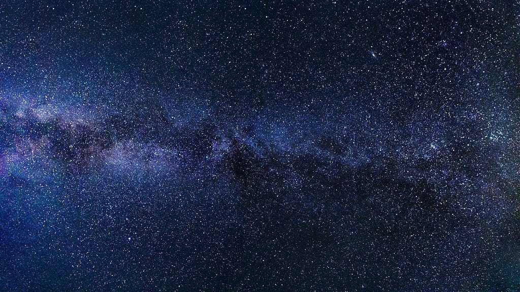 The Milky Way crossing a night sky full of stars