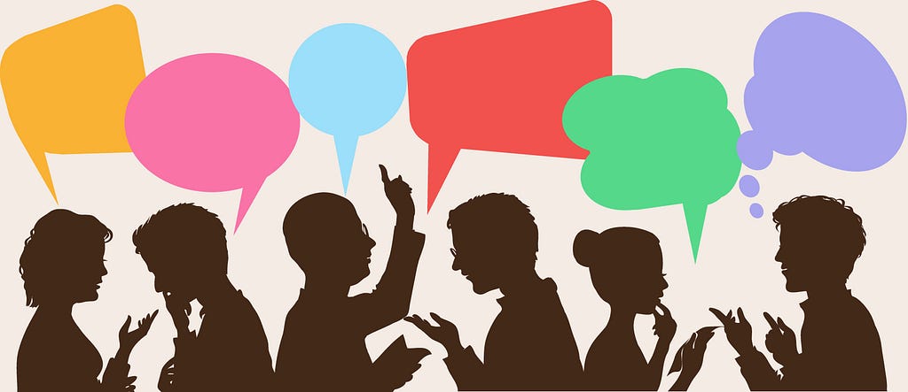 Silhouettes of people talking beneath colourful speech bubbles